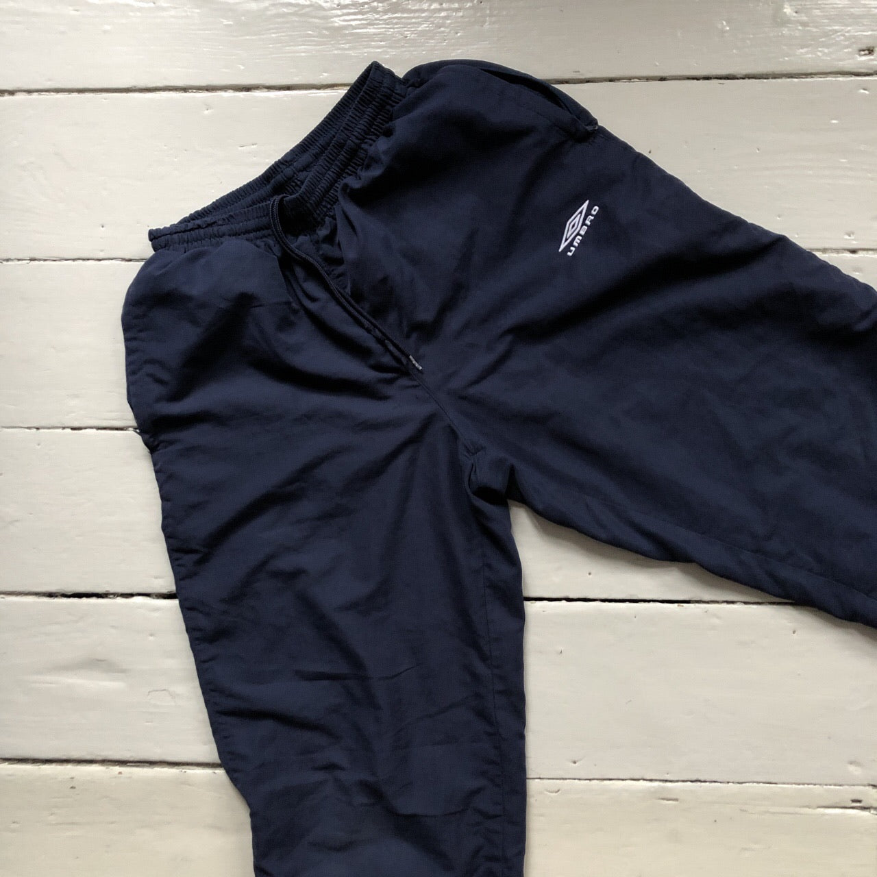 Umbro navy shell bottoms size S