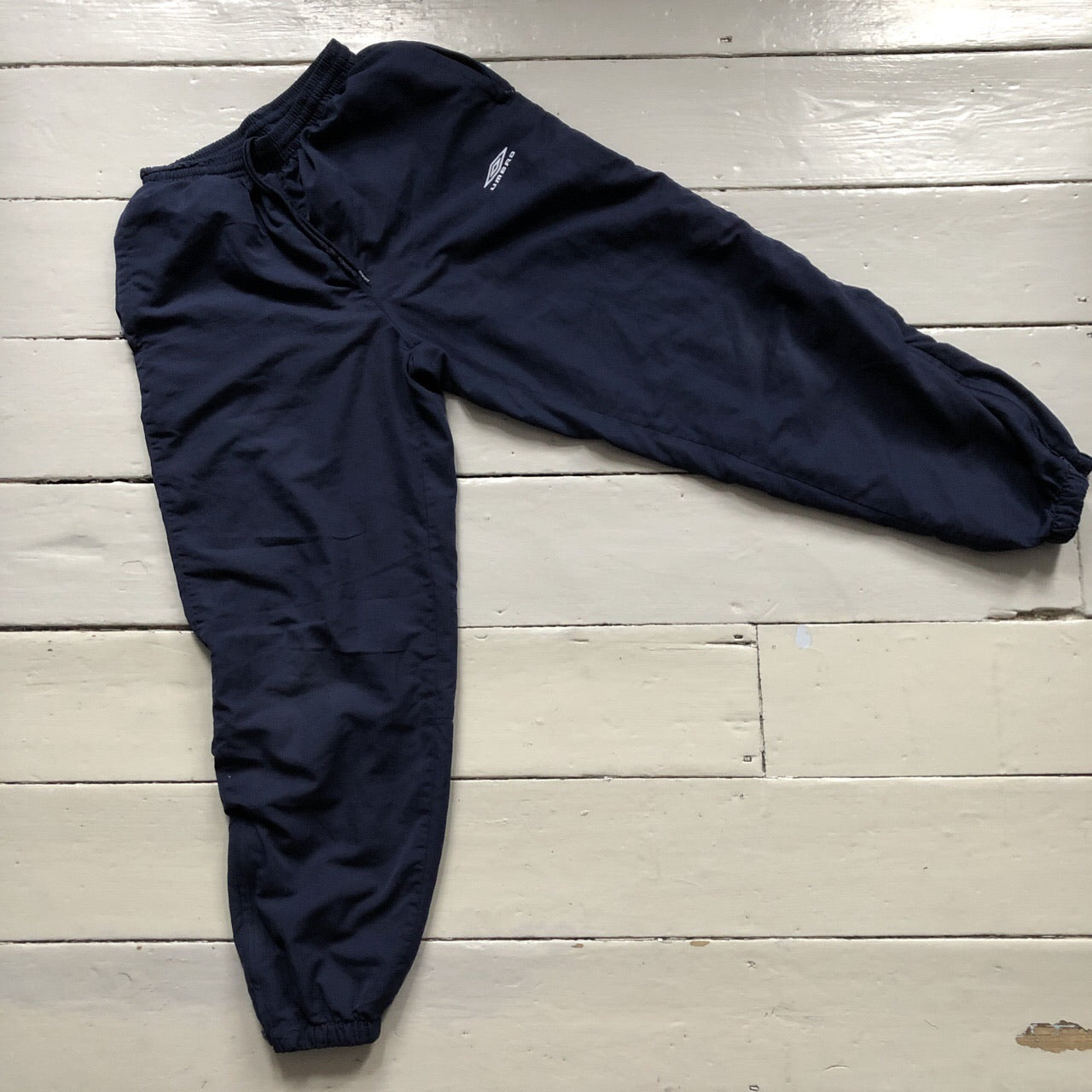 Umbro navy shell bottoms size S
