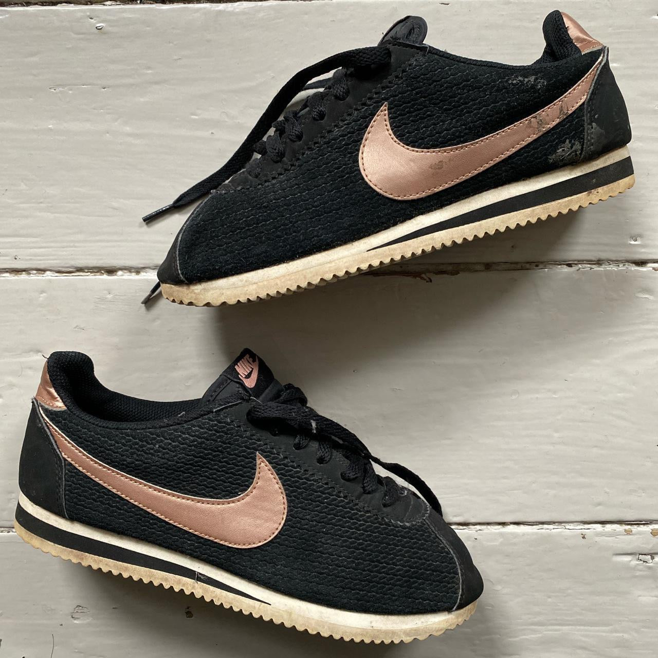 Rose gold and black nike clearance cortez